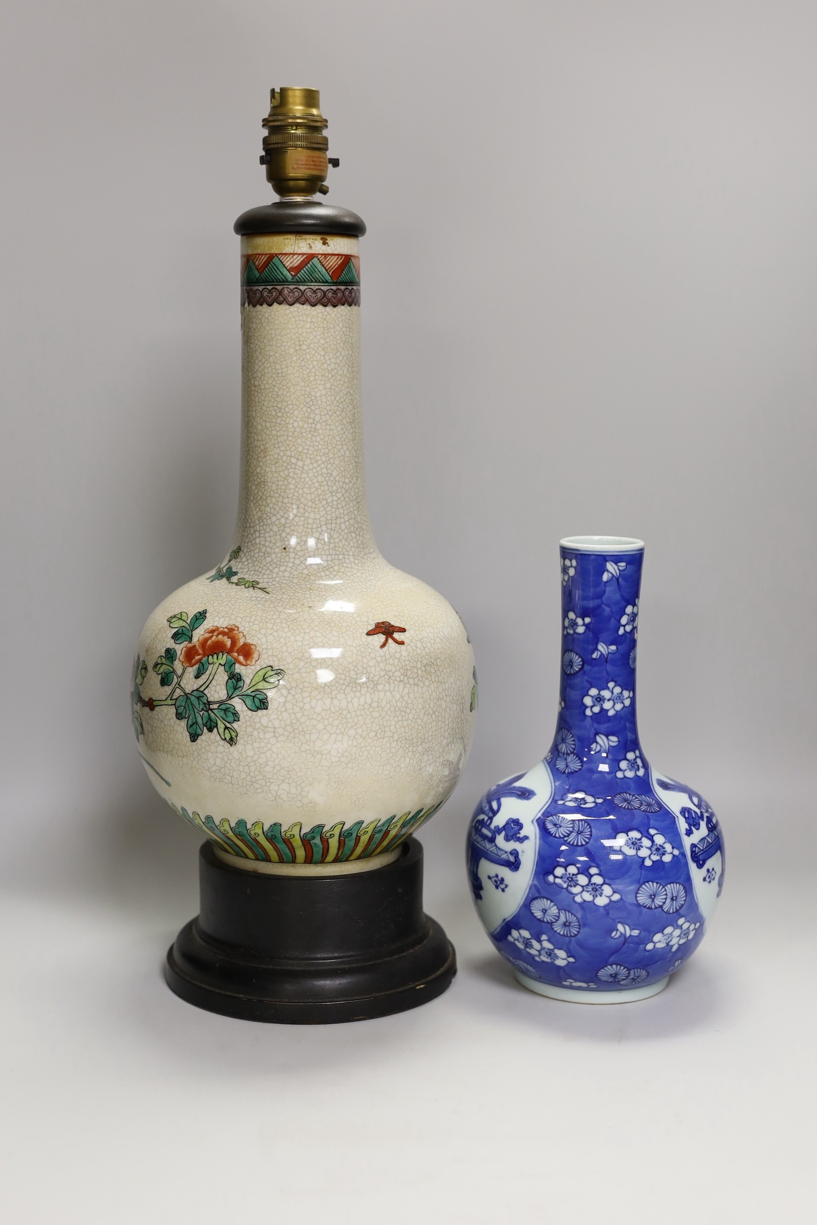 A Chinese crackle glaze ‘phoenix’ vase mounted as a lamp and a similar blue and white bottle vase